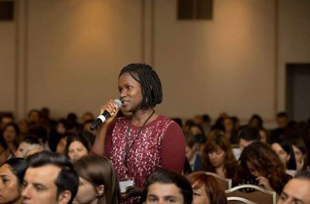 Victoria Lihiru asks question during the Professional Fellows Congress